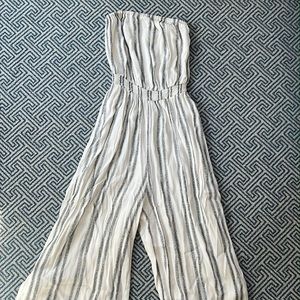 Silence + Noise strapless white and navy blue striped jumpsuit.